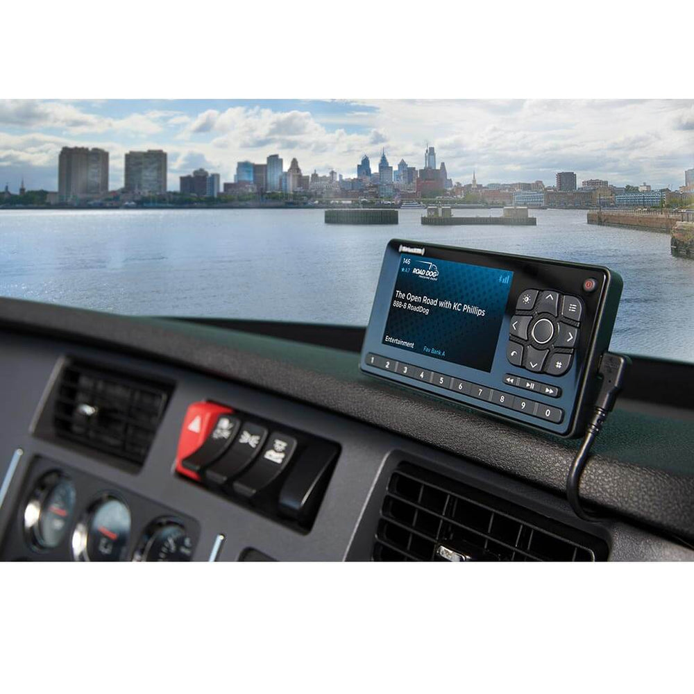 Roady BT SiriusXM receiver installed on a truck dashboard without a docking cradle